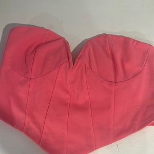 pink strapless top, cut v neck style